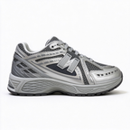 New Balance Classic Y2K retro running sneakers 1906R silver grey metallic colorway, unisex dad shoes for men and women.
