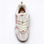 New Balance Classic retro running sneakers 530 off white light pink colorway, unisex dad sneakers, especially popular for ladies.