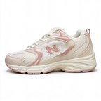 New Balance Classic retro running sneakers 530 off white light pink colorway, unisex dad sneakers, especially popular for ladies.