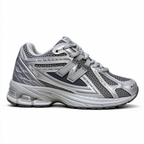 New Balance Classic Y2K retro running sneakers 1906R silver grey metallic colorway, unisex dad shoes for men and women.