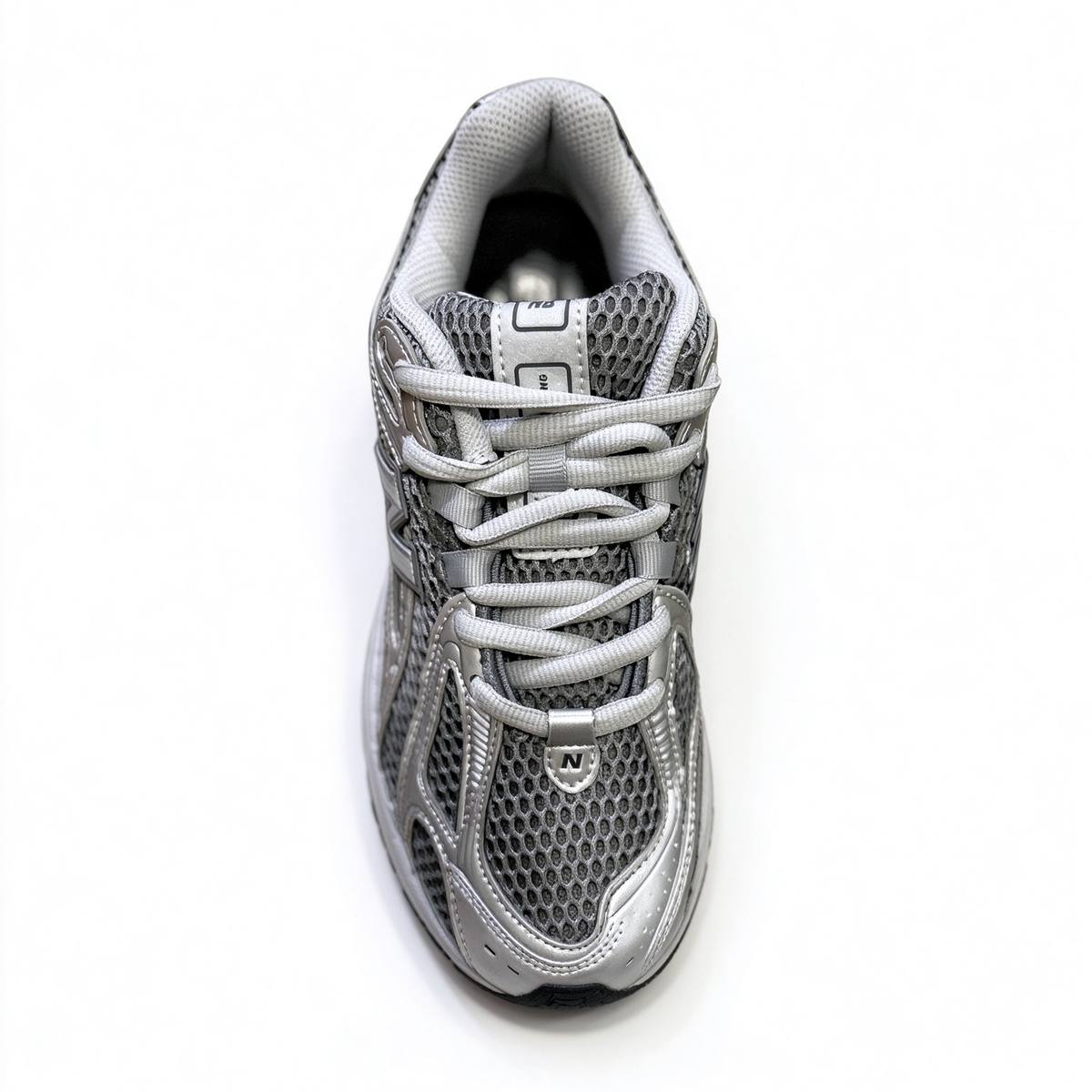 New Balance Classic Y2K retro running sneakers 1906R silver grey metallic colorway, unisex dad shoes for men and women.