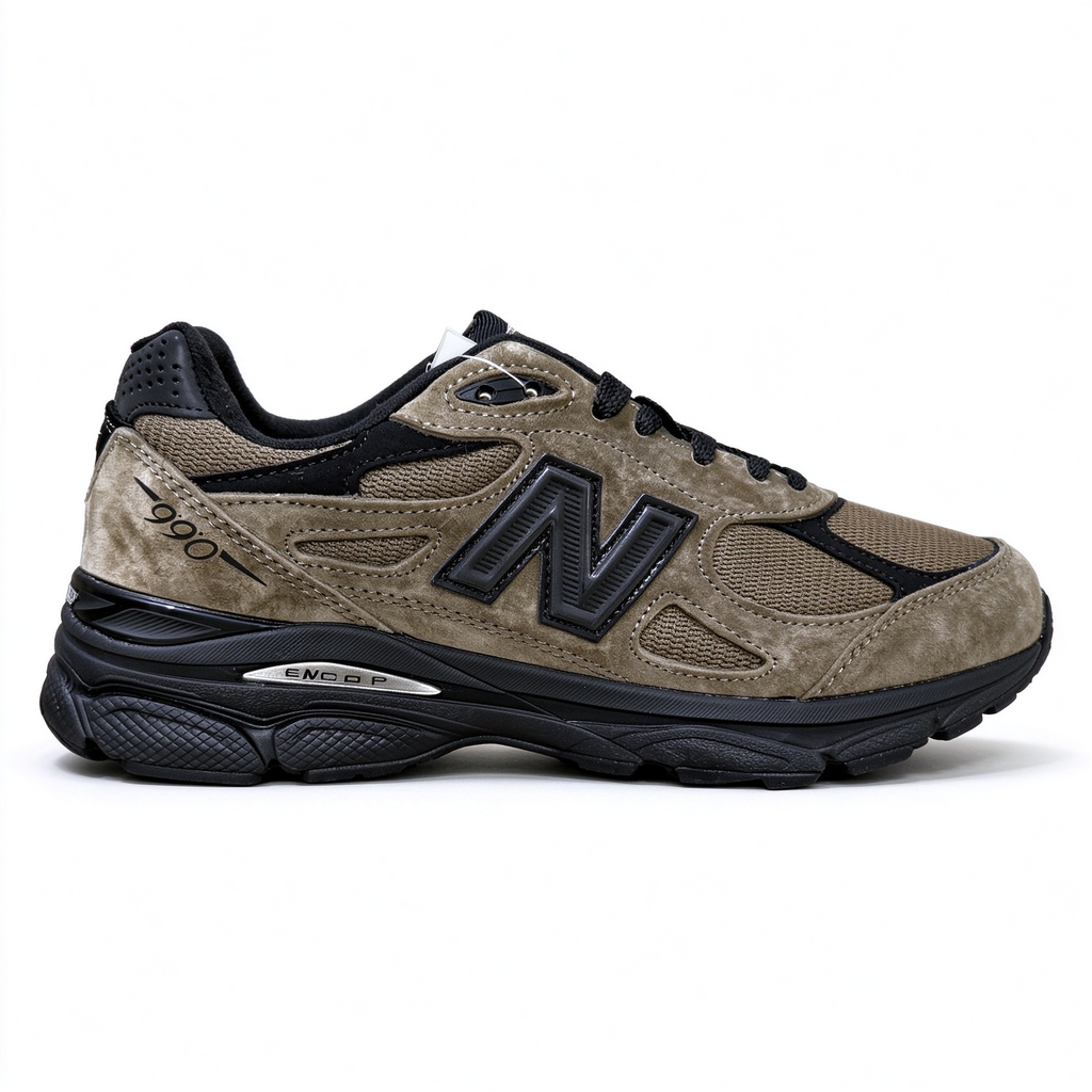 JJJJound x New Balance 990v3 classic collaboration model, Made in USA style. Premium brown suede matched with breathable mesh fabric, iconic dark black overlay, low-key vintage aesthetic, highly versatile for streetwear outfits.