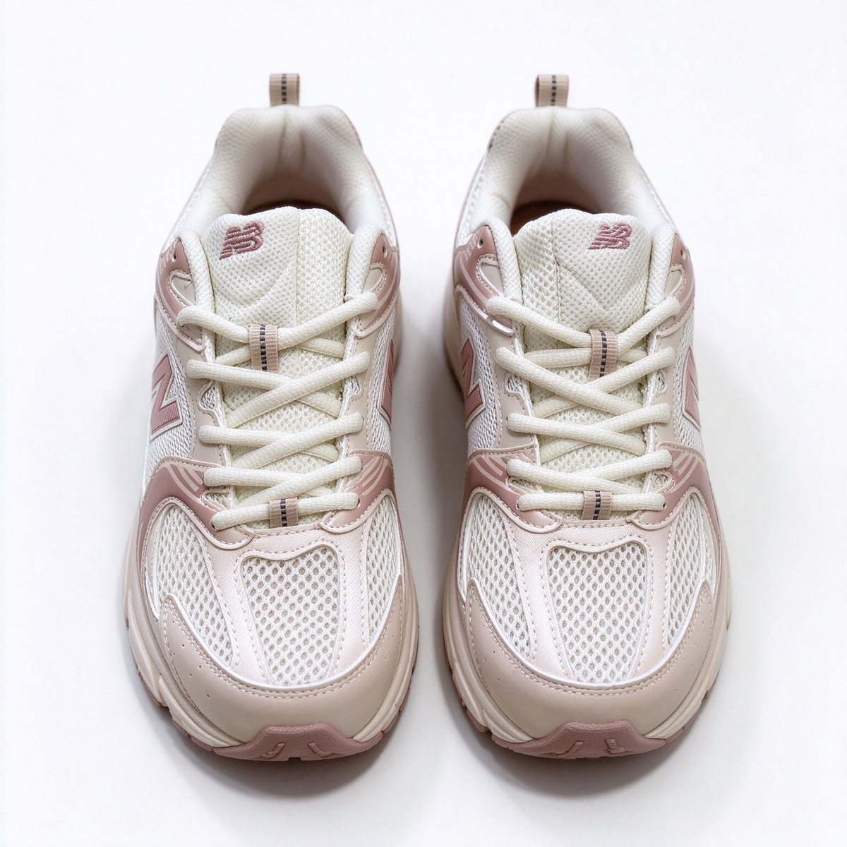 New Balance Classic retro running sneakers 530 off white light pink colorway, unisex dad sneakers, especially popular for ladies.