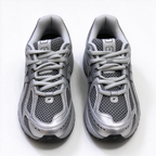 New Balance Classic Y2K retro running sneakers 1906R silver grey metallic colorway, unisex dad shoes for men and women.